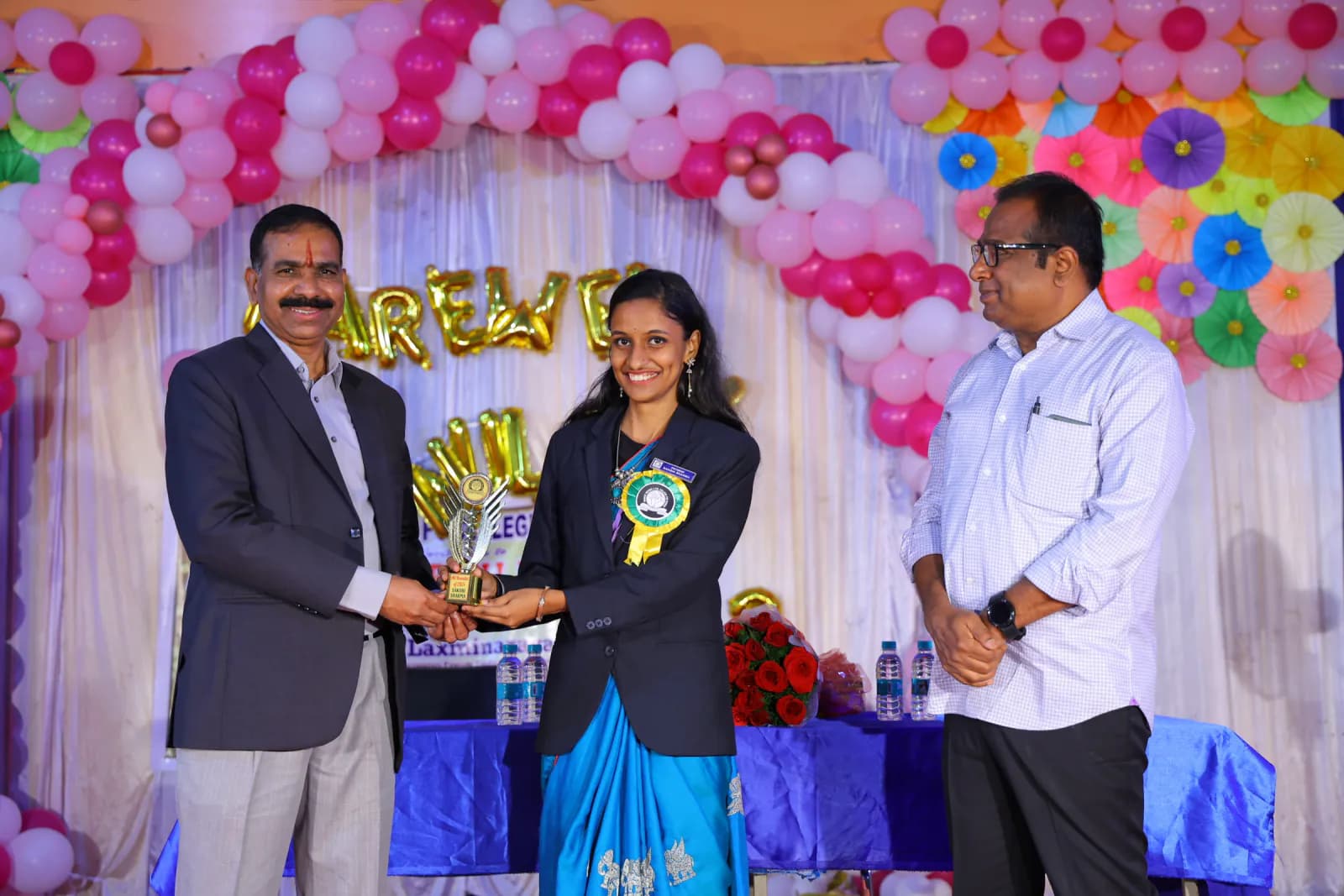 Student receiving academic recognition at a college event